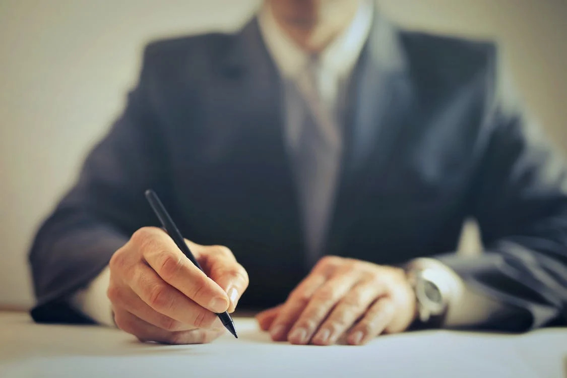 A lawyer signing documents 